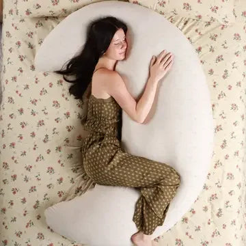 Posición abrazando la almohada